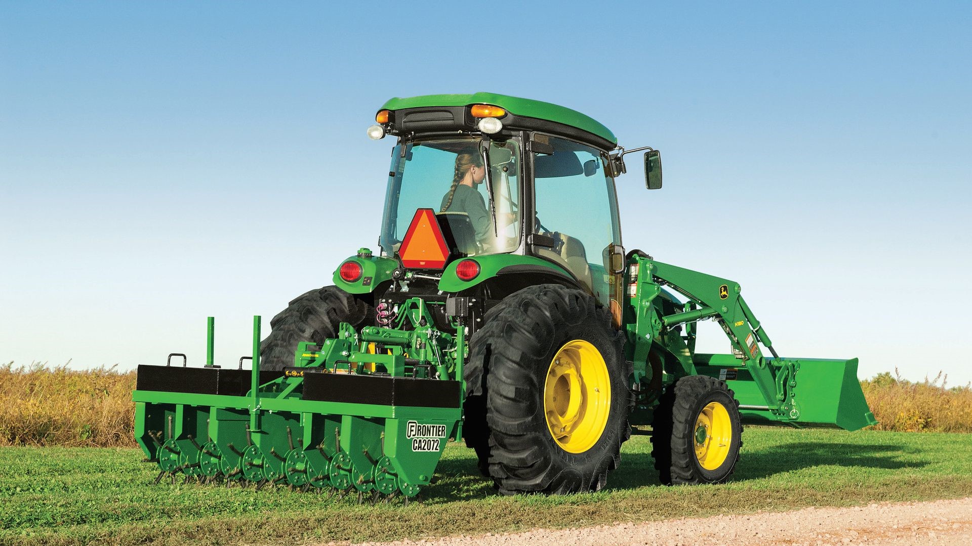 Aerator on a compact utility tractor