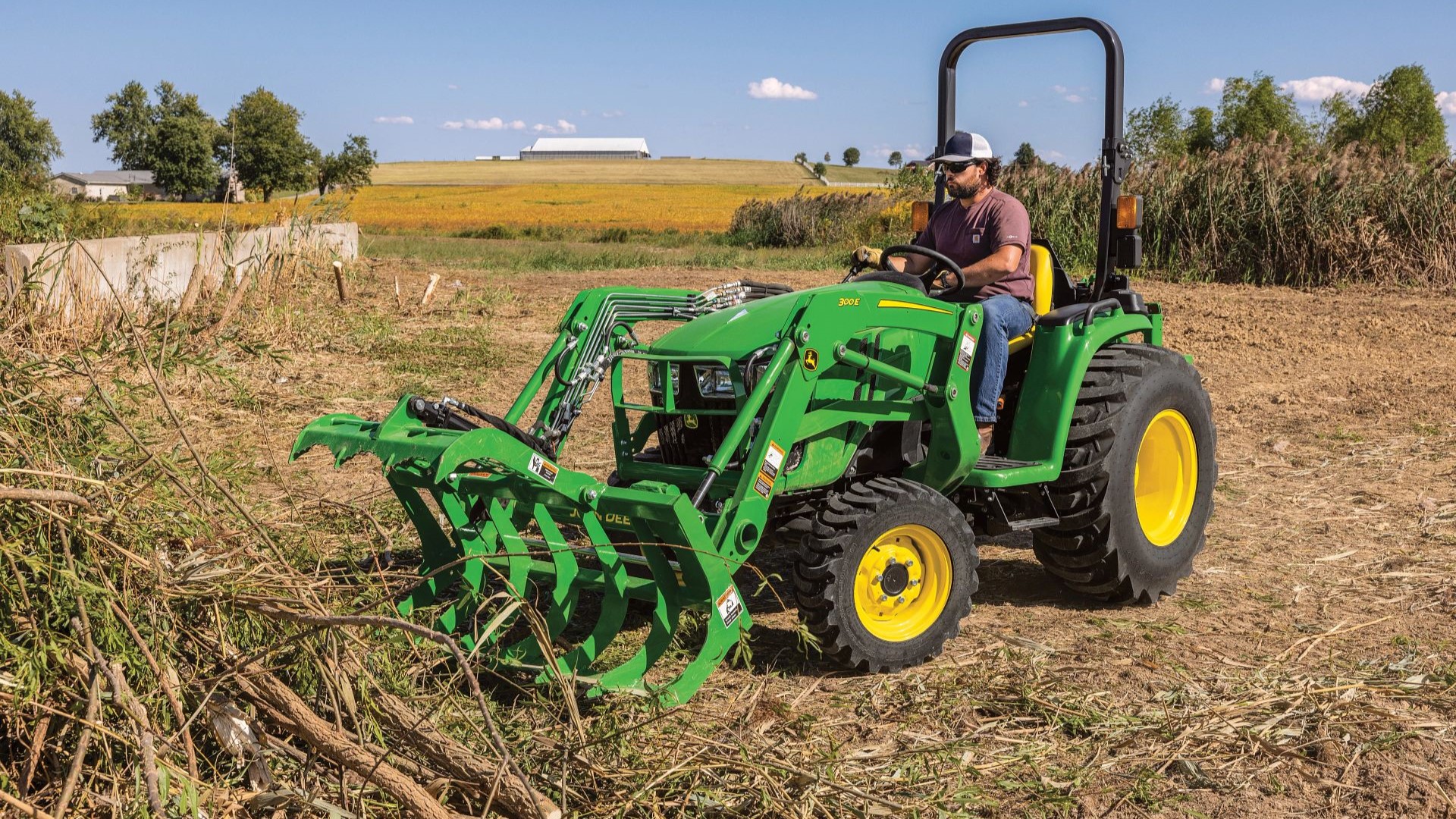 Grapples on a compact utility tractor